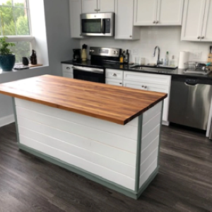 White kitchen island with wood top